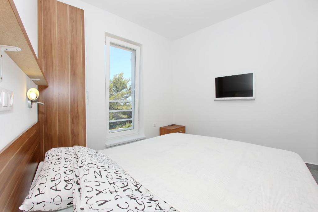 Posteľ alebo postele v izbe v ubytovaní Apartments Vila Moli