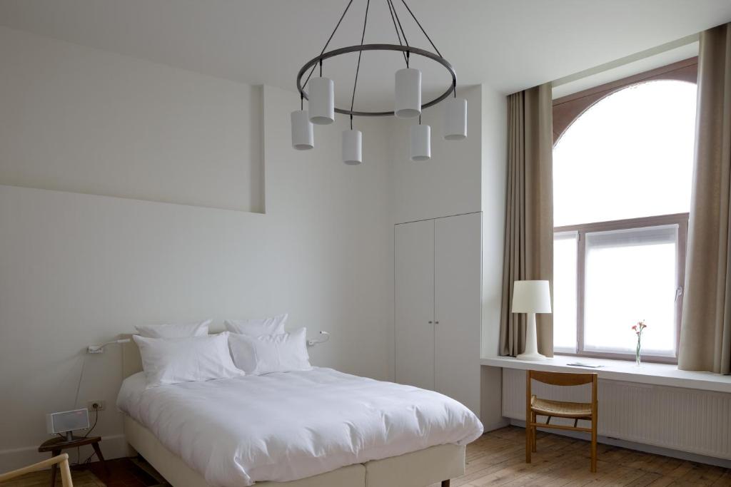 Voodi või voodid majutusasutuse Hotel Wu Wei toas