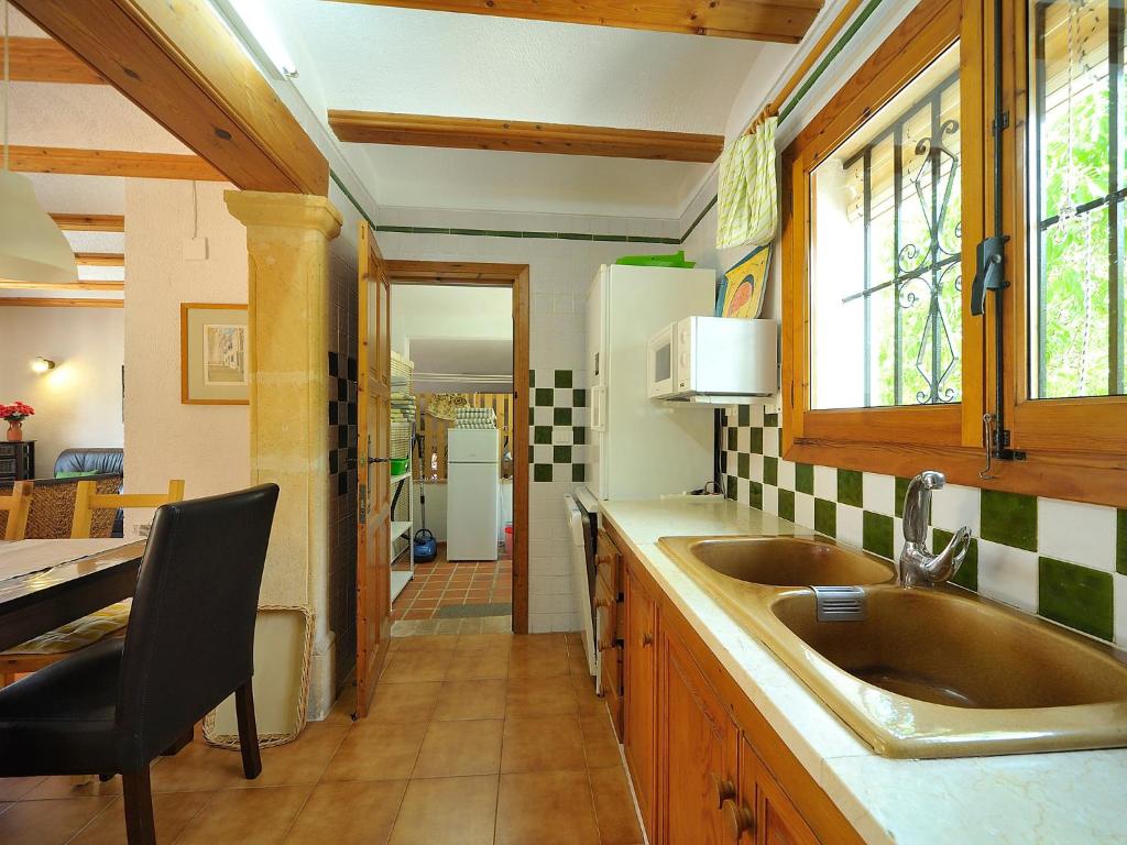 Kuchyň nebo kuchyňský kout v ubytování Holiday Home Reposo by Interhome