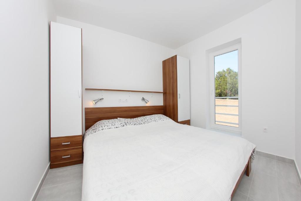 Posteľ alebo postele v izbe v ubytovaní Apartments Vila Moli