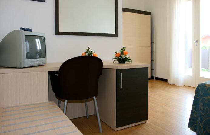 TV a/nebo společenská místnost v ubytování Hotel Al Fogo