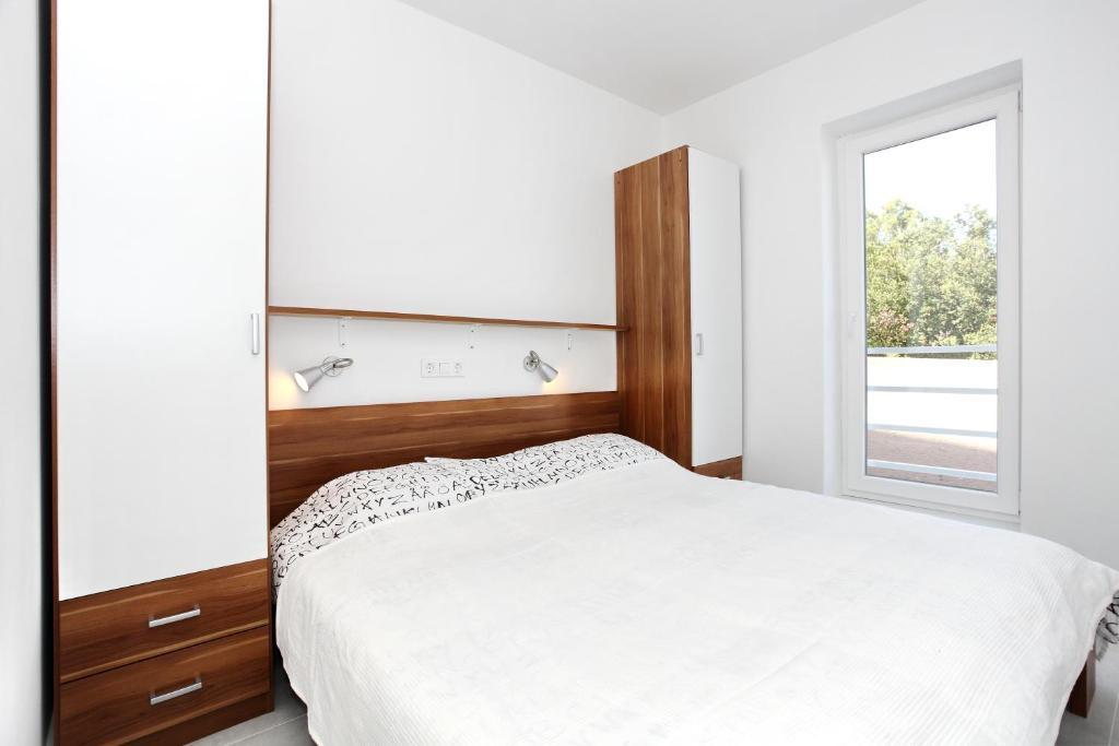 Posteľ alebo postele v izbe v ubytovaní Apartments Vila Moli