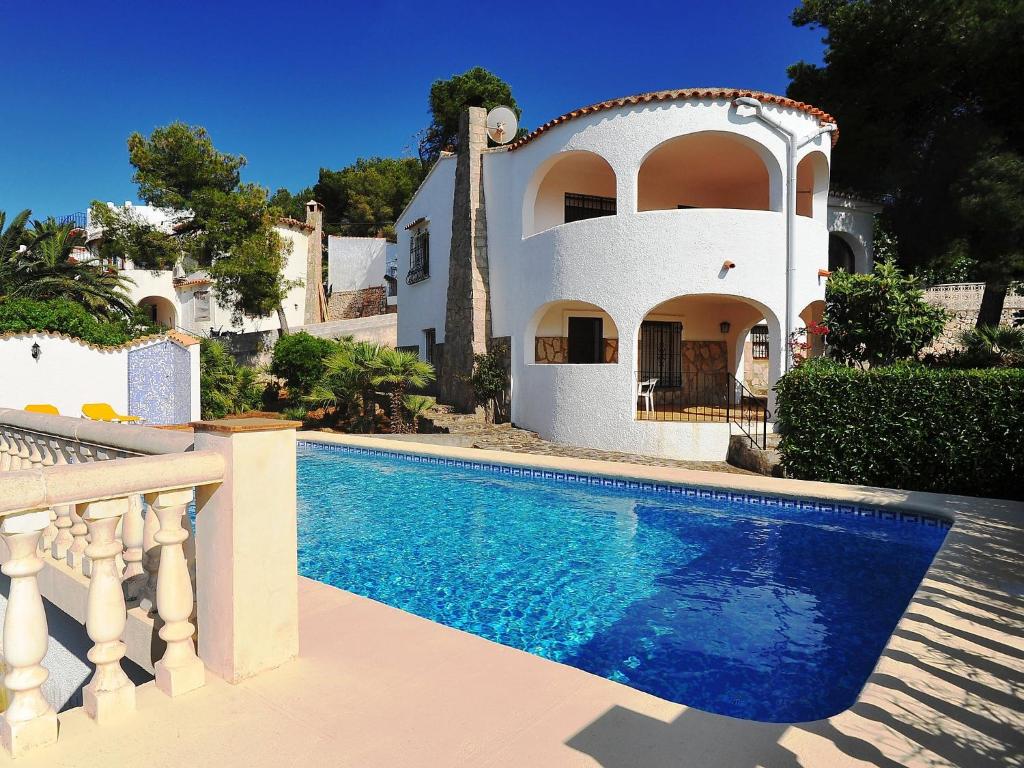 a house with a swimming pool in front of a house at Holiday Home Balcon al Mar by Interhome in Balcon del Mar