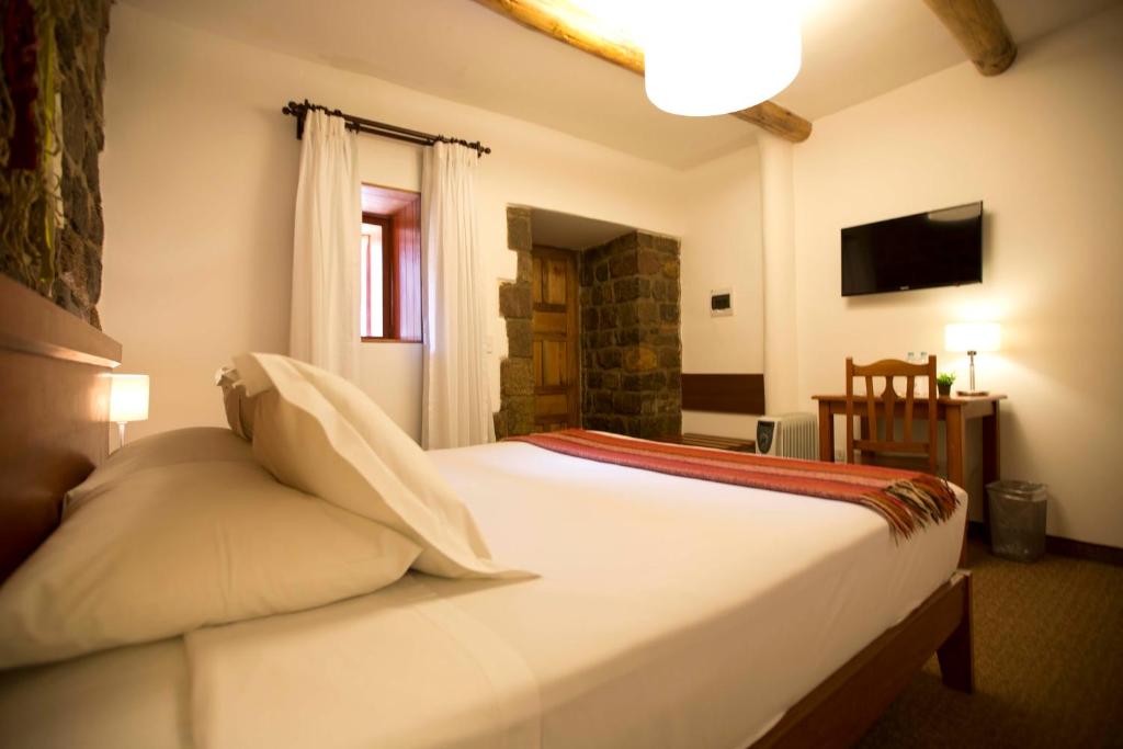 Postel nebo postele na pokoji v ubytování Tierra Viva Cusco Centro