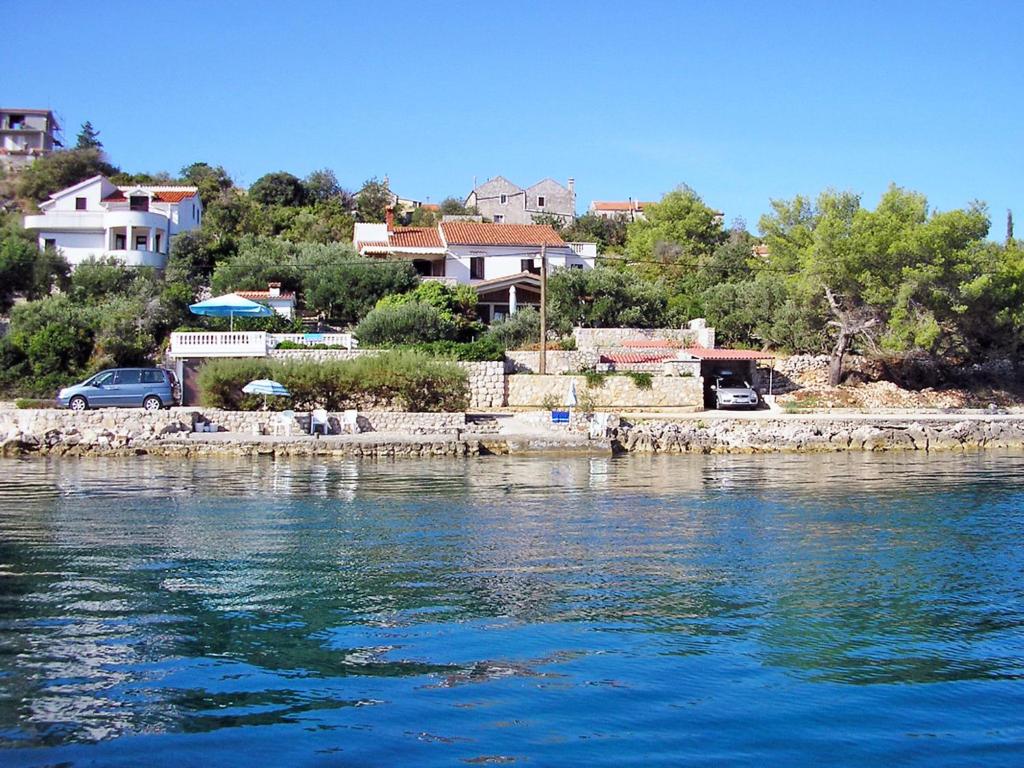a view of a body of water with houses at Holiday Home Mirta by Interhome in Iž Mali