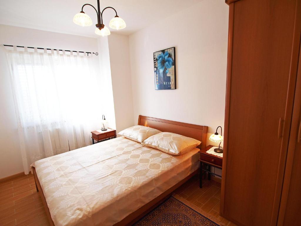 Postel nebo postele na pokoji v ubytování Holiday Home Mirela by Interhome