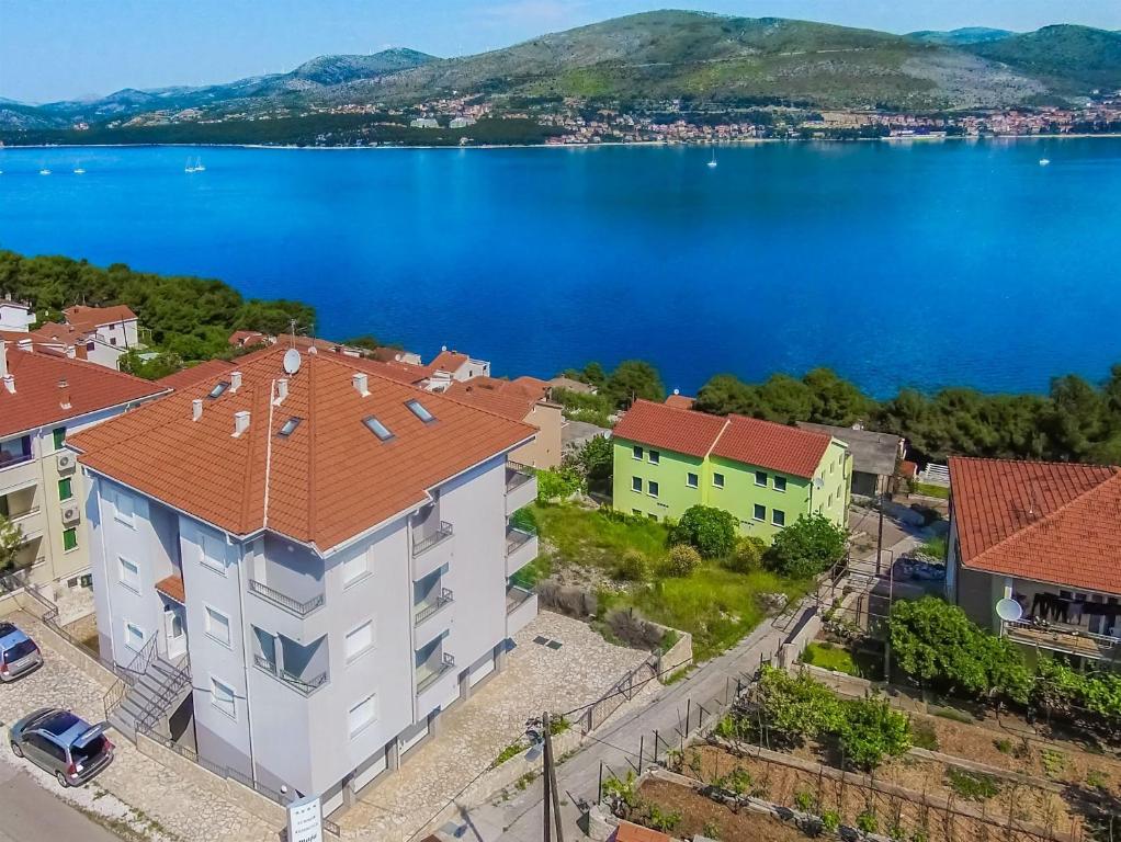 an aerial view of a town with a lake at Apartments Maja in Okrug Donji