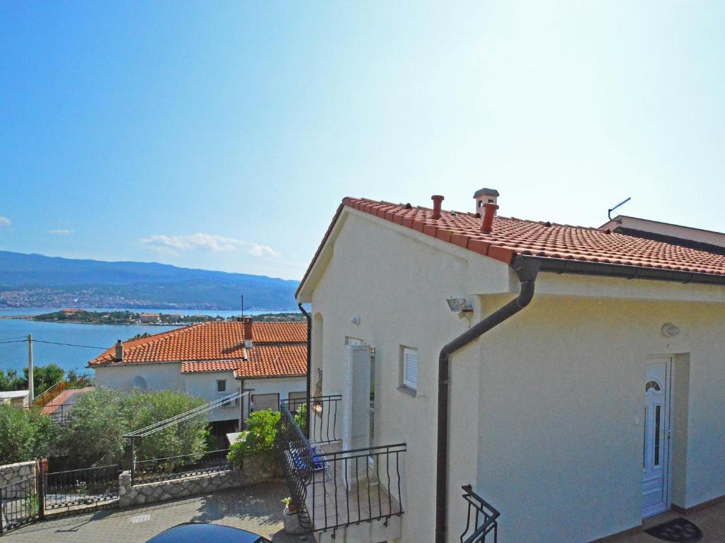 a white house with a view of the water at Holiday Home Ivan by Interhome in Šilo