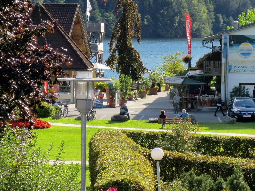 a street in a town with a lake in the background at Apartment Annemarie by Interhome in Glanz