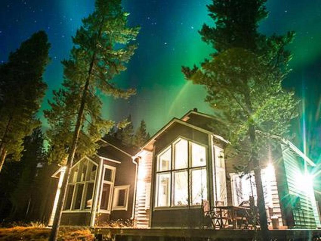 a house with the lights on at night at Holiday Home Oppas lapland levi by Interhome in Levi