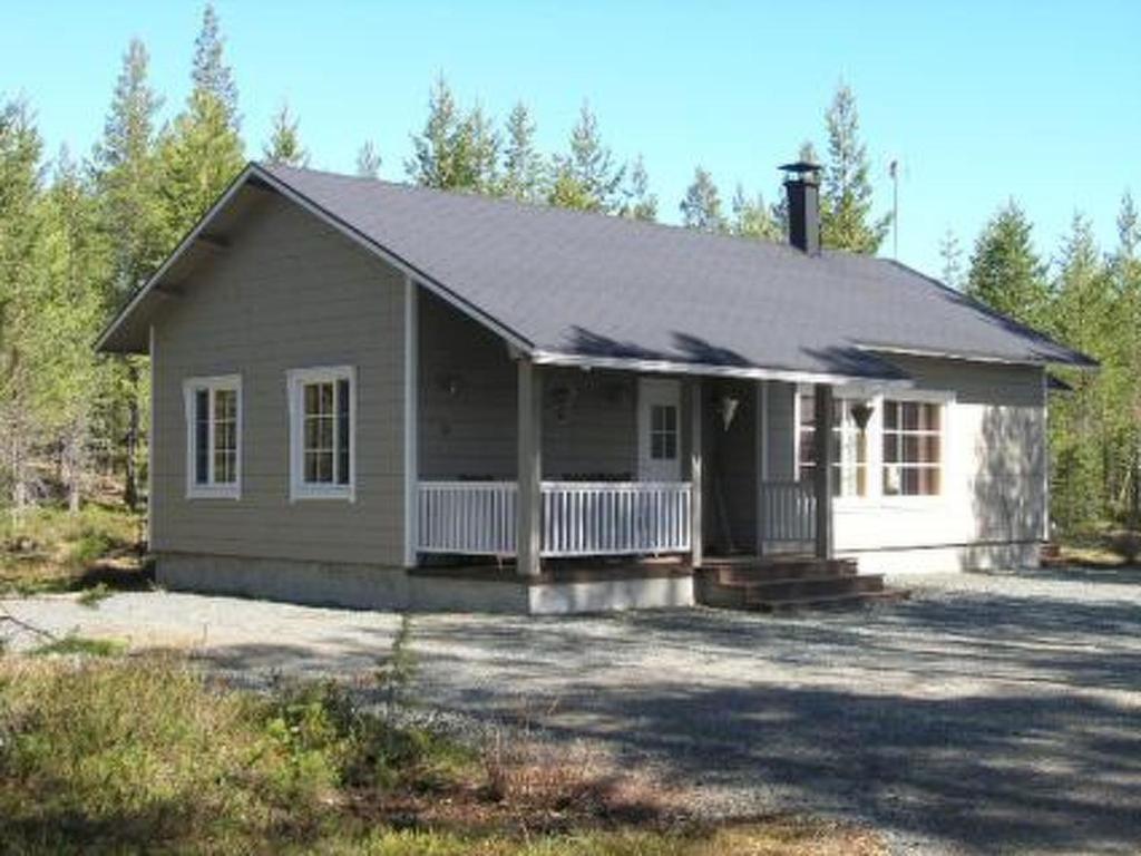 a small house in the middle of a yard at Holiday Home Akanlampi by Interhome in Karvonen