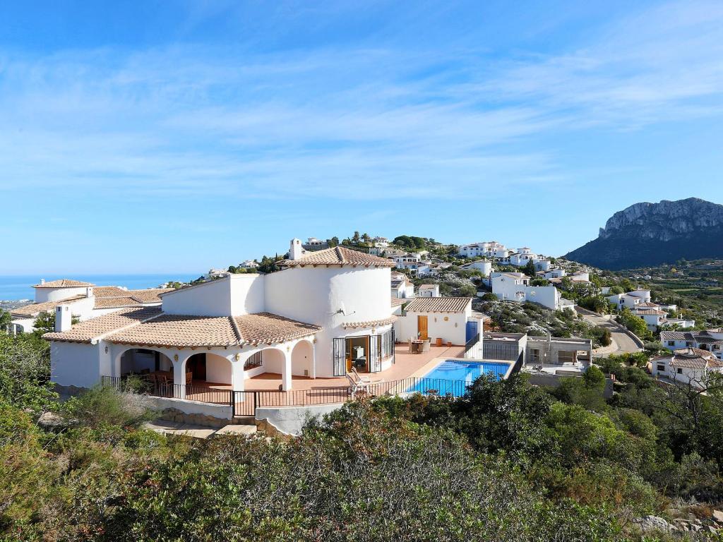 a large white house on top of a hill at Villa Salvador by Interhome in Monte Pego
