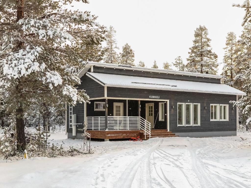 a small house in the snow in the woods at Holiday Home Kuukkeli by Interhome in Kyrö