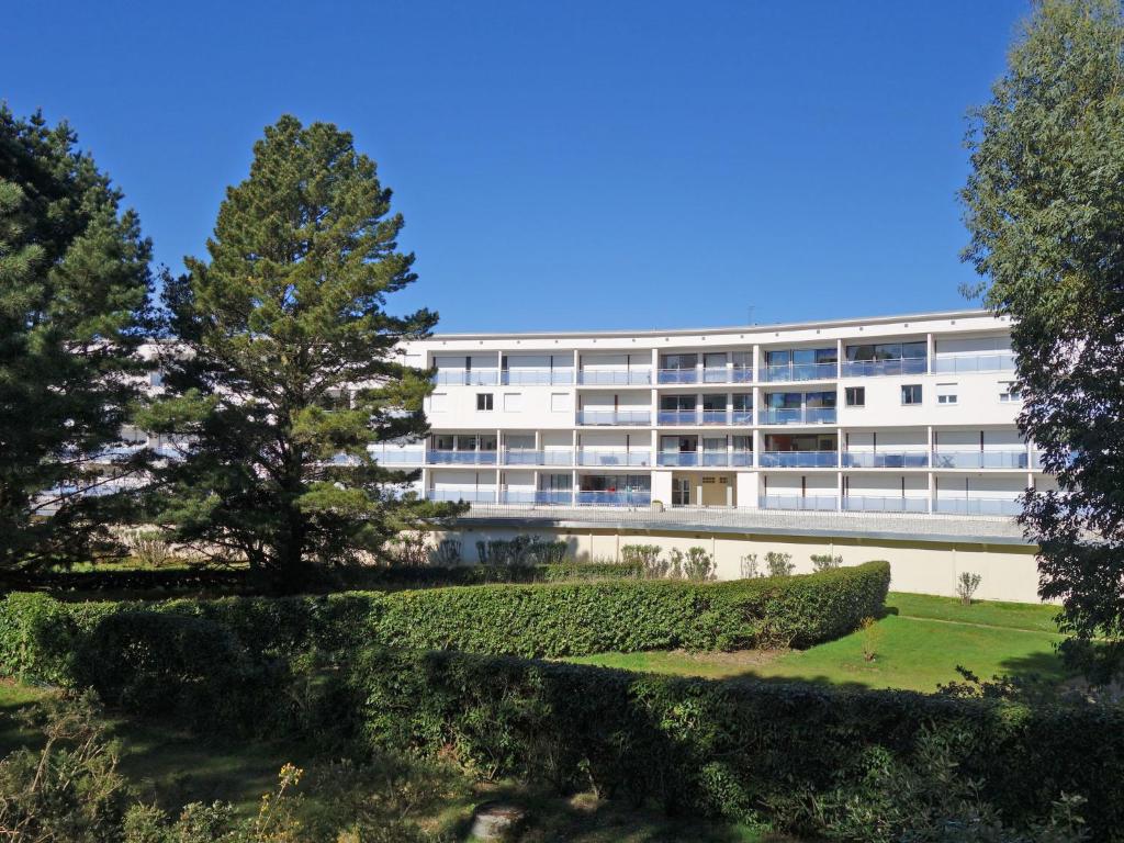 a white building with trees in front of it at Apartment Men Er Bellec-1 by Interhome in Saint-Philibert