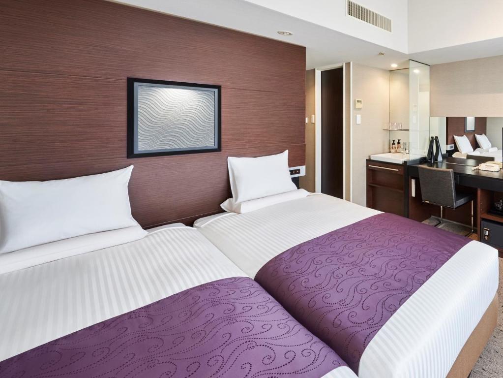 Postel nebo postele na pokoji v ubytování HOTEL MYSTAYS Shimizu
