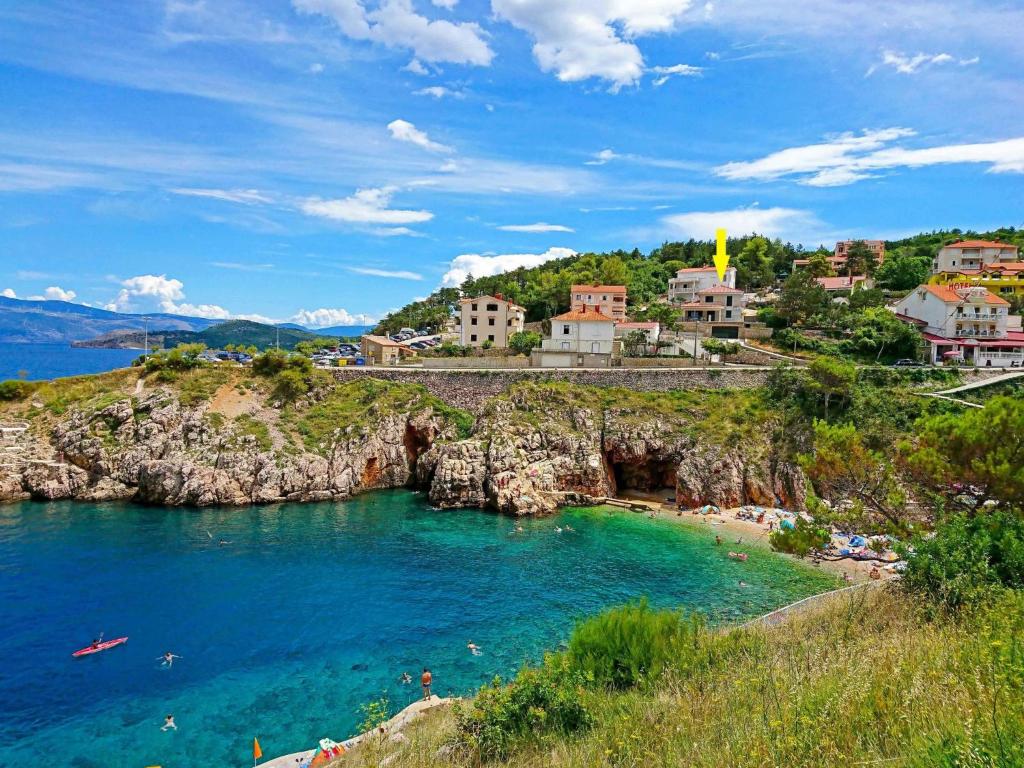 a group of people on a beach in the water at Villa Vali 1 by Interhome in Vrbnik