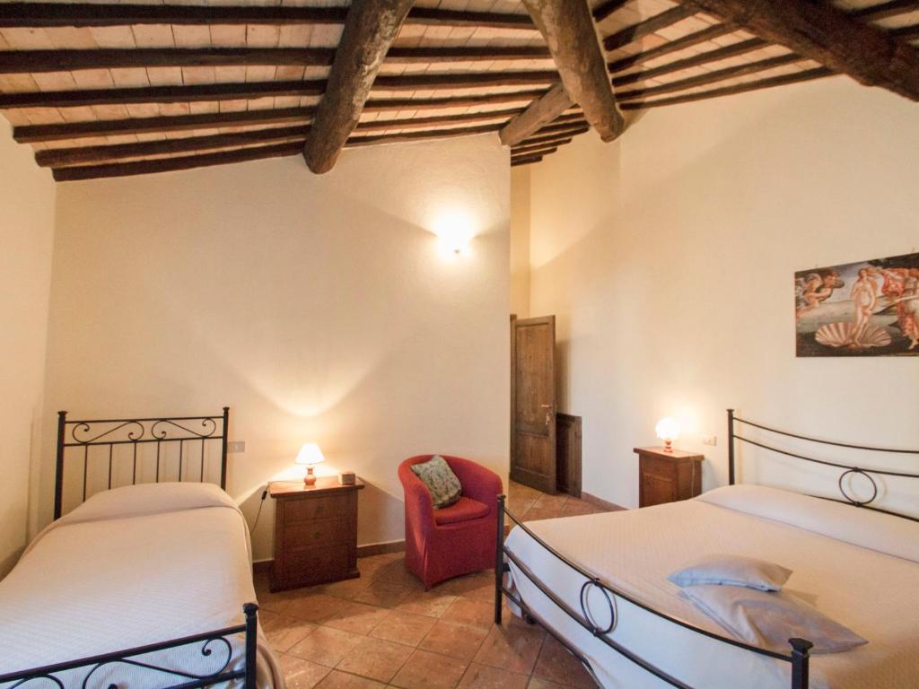 A bed or beds in a room at Holiday Home Montecucco Winery by Interhome