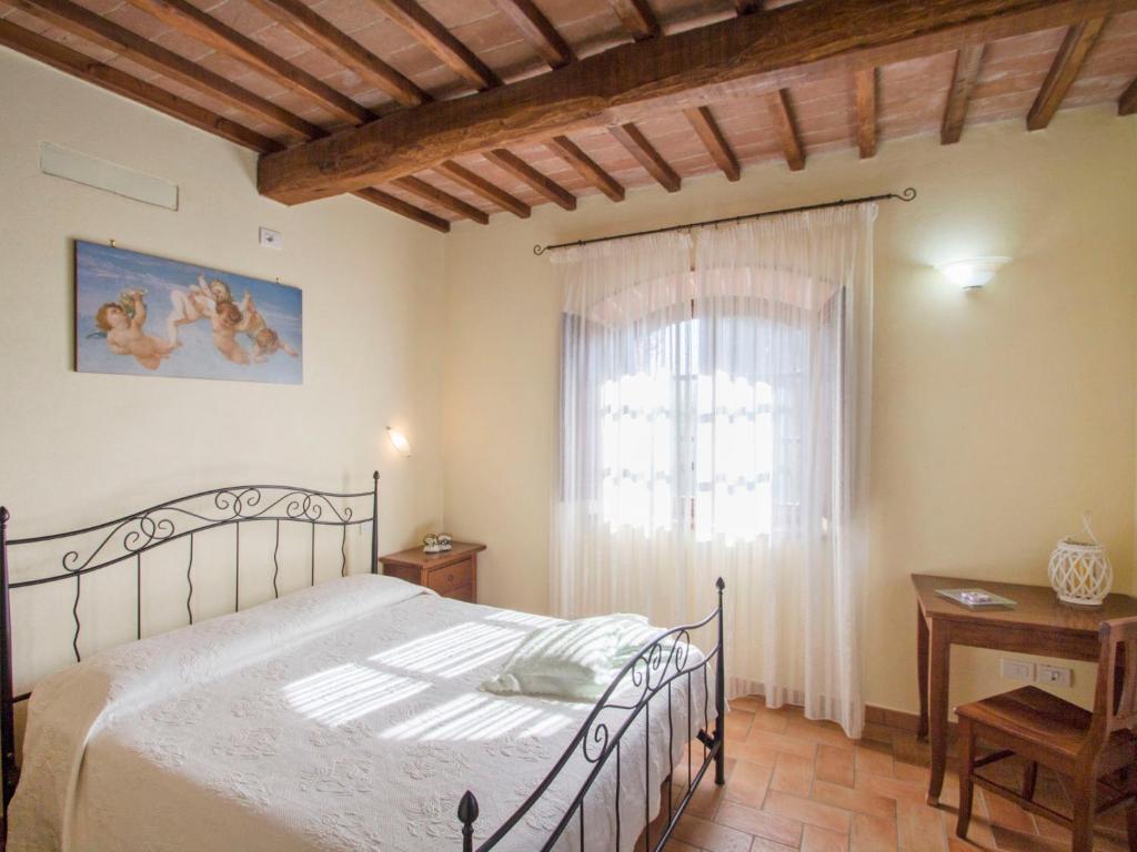 A bed or beds in a room at Holiday Home Montecucco Winery by Interhome