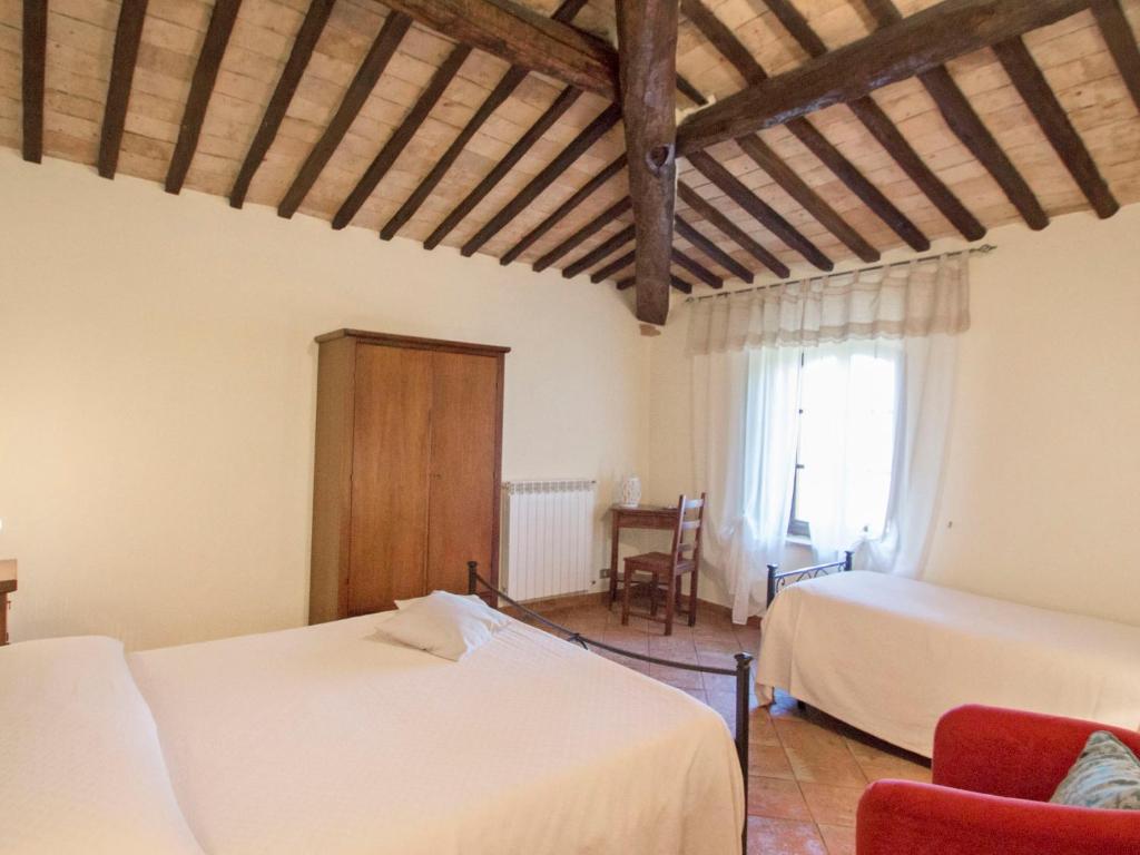 A bed or beds in a room at Holiday Home Montecucco Winery by Interhome