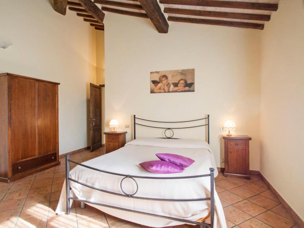 A bed or beds in a room at Holiday Home Montecucco Winery by Interhome