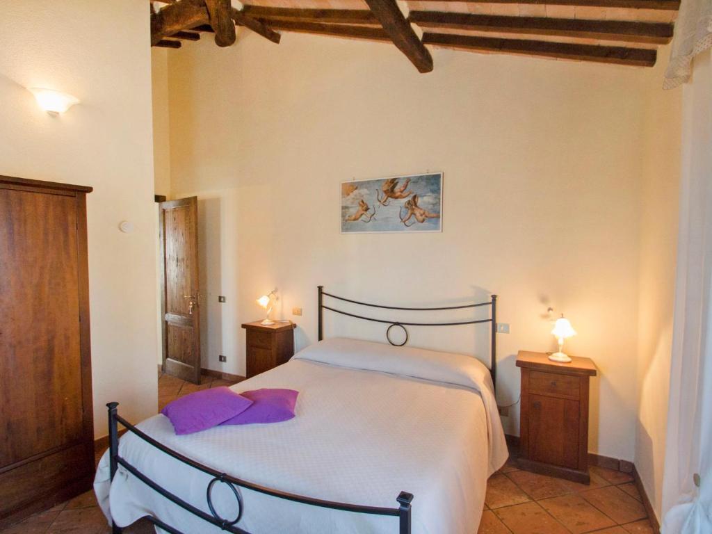 A bed or beds in a room at Holiday Home Montecucco Winery by Interhome