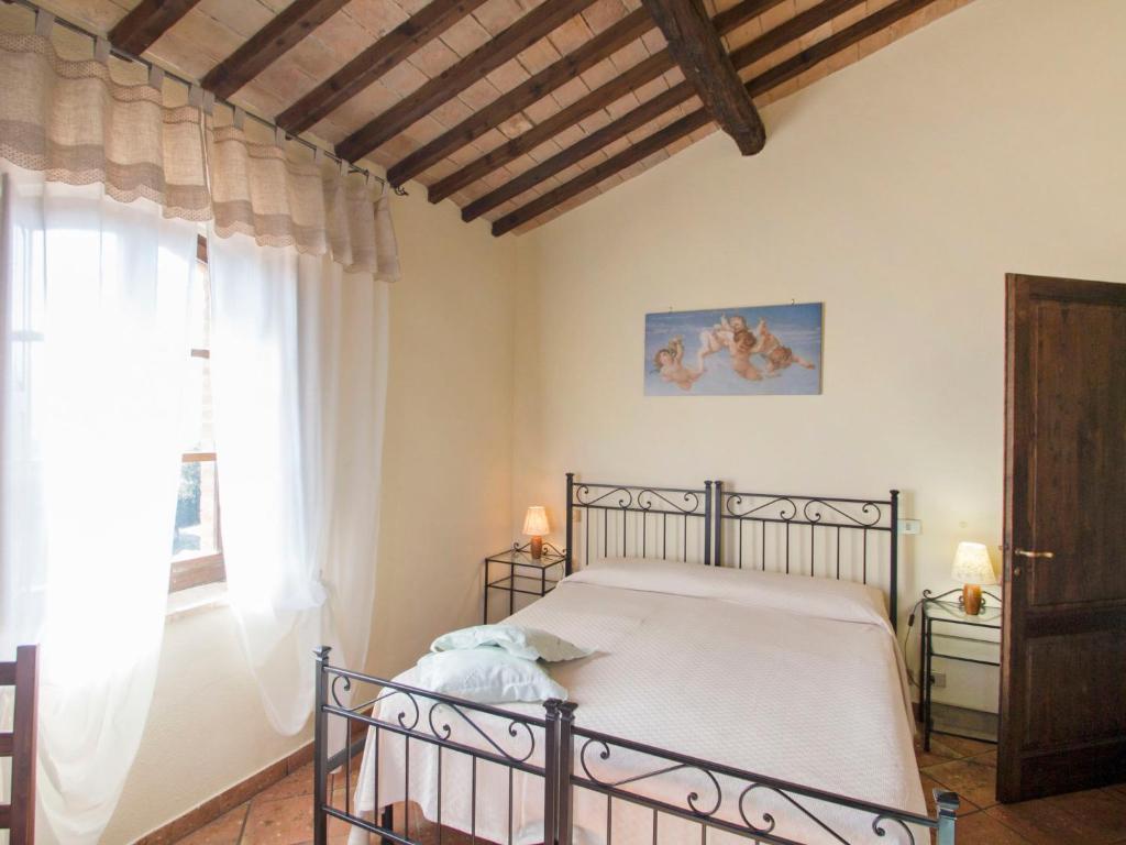 A bed or beds in a room at Holiday Home Montecucco Winery by Interhome