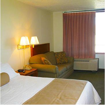 Postel nebo postele na pokoji v ubytování Fenwick Islander Motel