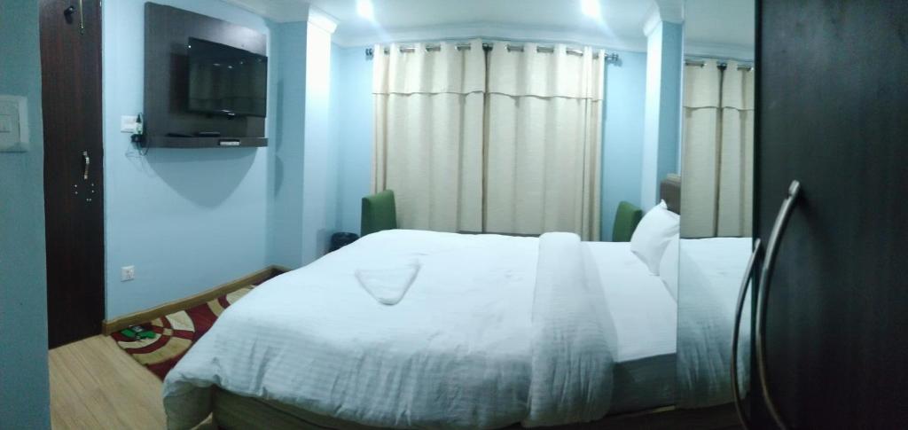 Postel nebo postele na pokoji v ubytování Hotel Samrajya Pvt. Ltd.