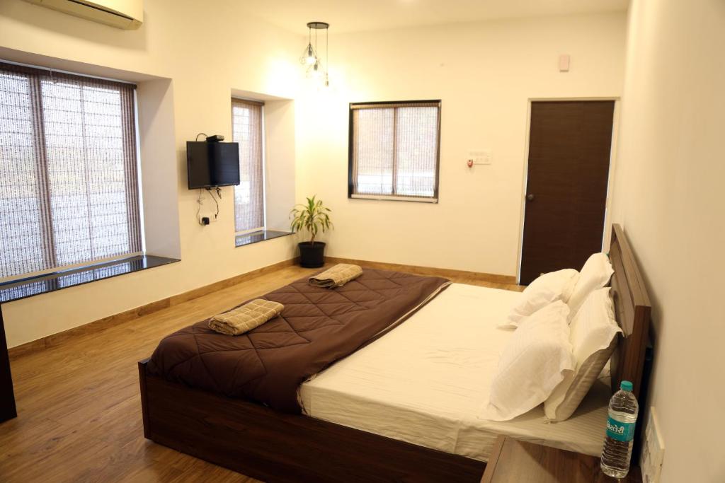 Postel nebo postele na pokoji v ubytování Tripvana Patio Home