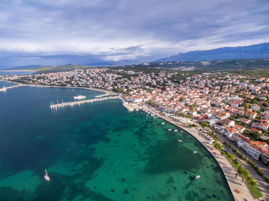 an aerial view of a city and a harbor at Apartments Karolina in Novalja