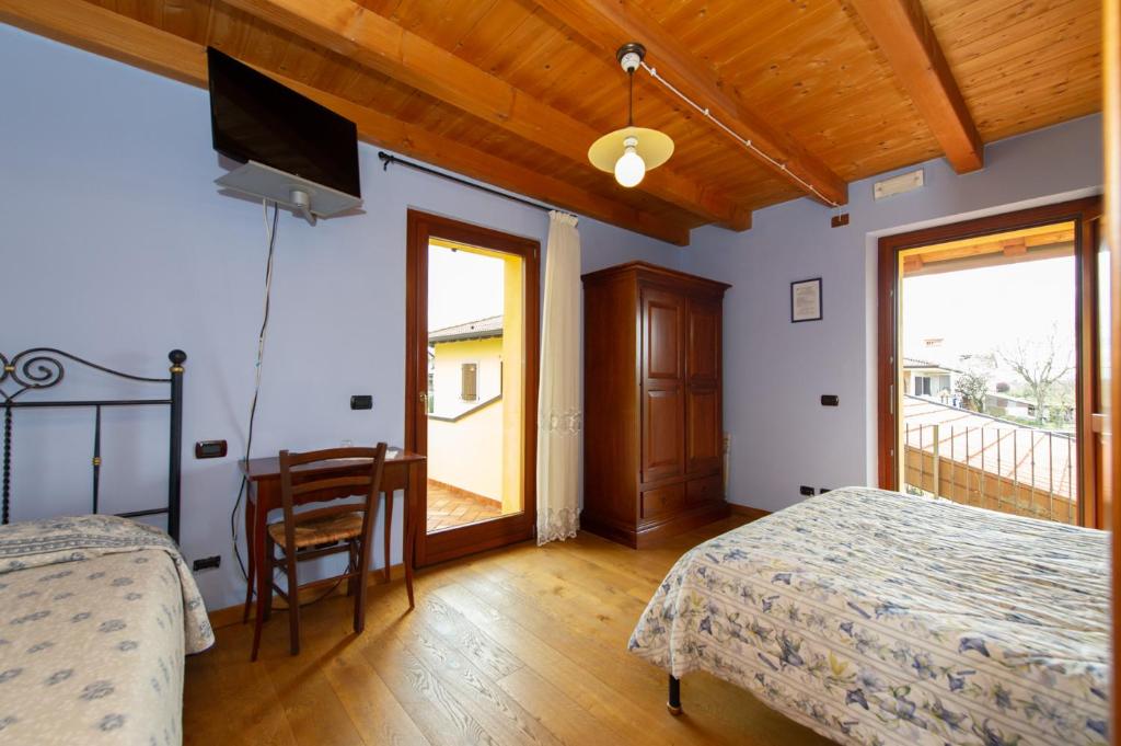Posteľ alebo postele v izbe v ubytovaní Agriturismo Lis Rosis