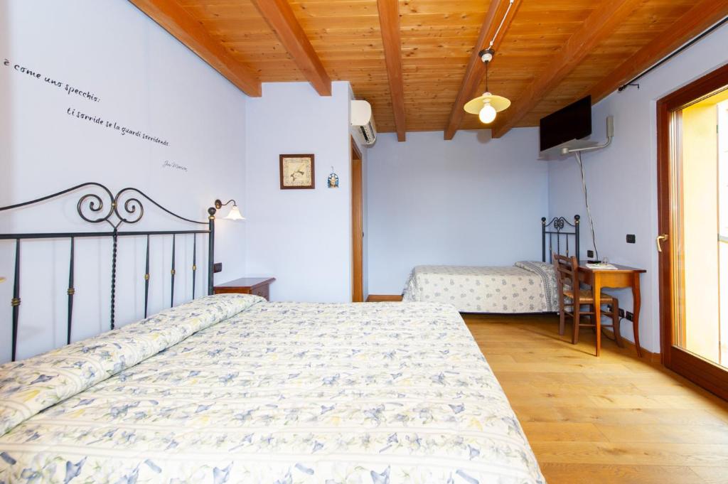 Posteľ alebo postele v izbe v ubytovaní Agriturismo Lis Rosis