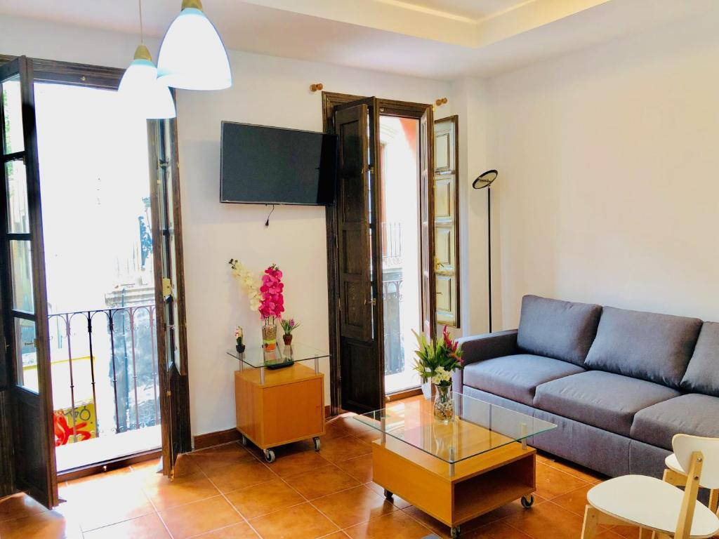 Posezení v ubytování tuGuest Plaza Nueva Apartment