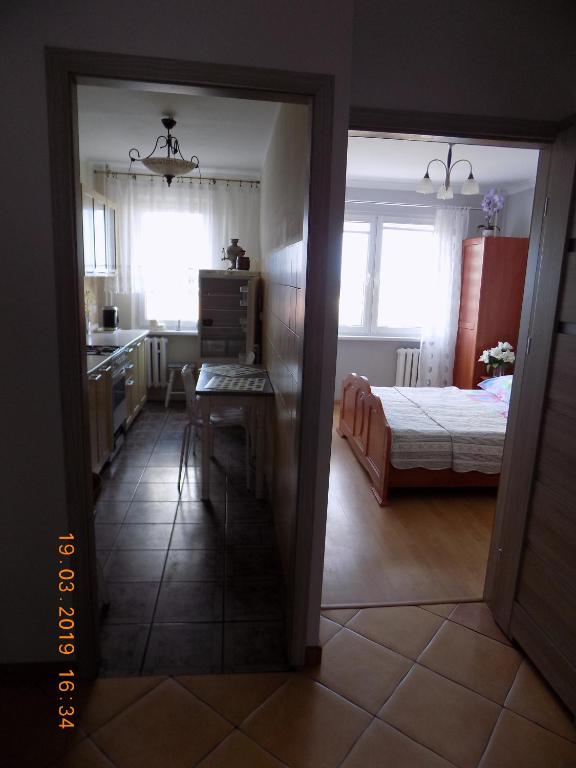 Posteľ alebo postele v izbe v ubytovaní APARTAMENT CENTRUM MIASTA