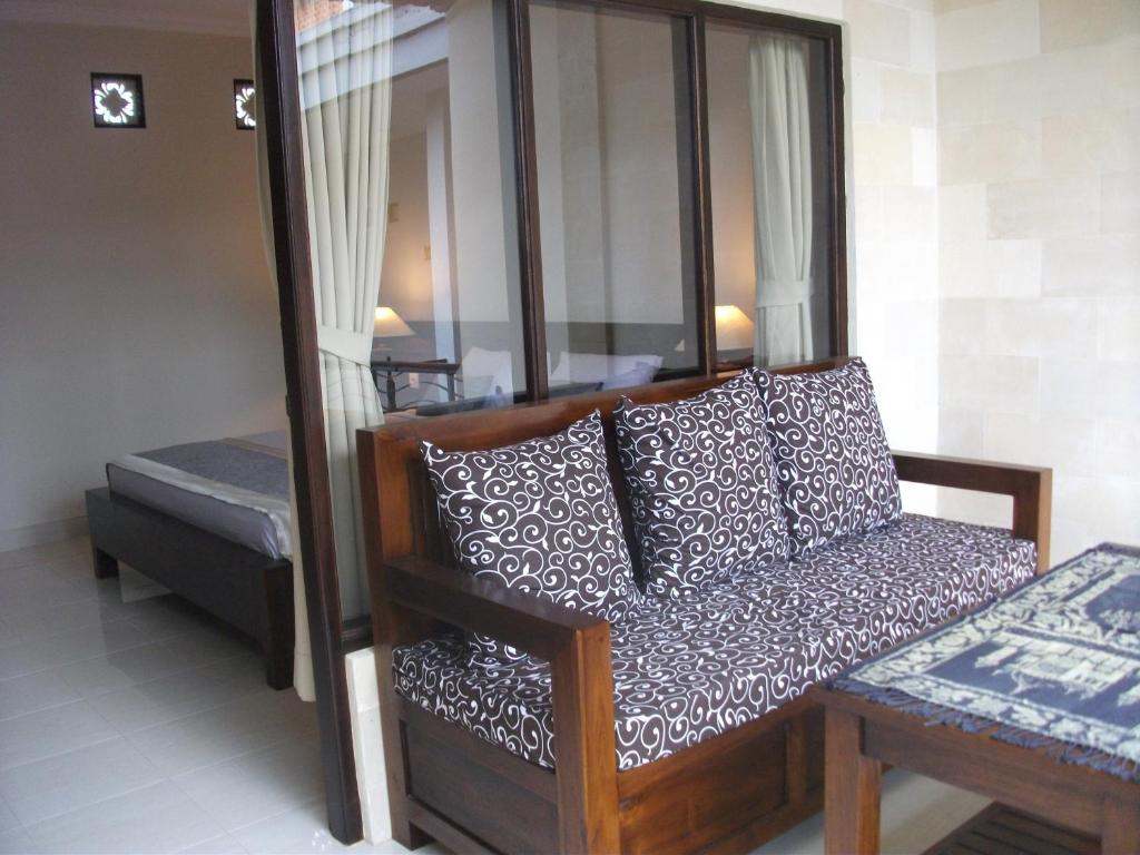 Postel nebo postele na pokoji v ubytování Gerhana Sari 2 Bungalows