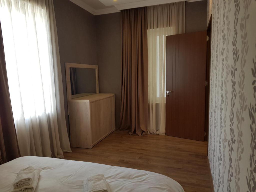 Postel nebo postele na pokoji v ubytování White House in Kakheti Eniseli