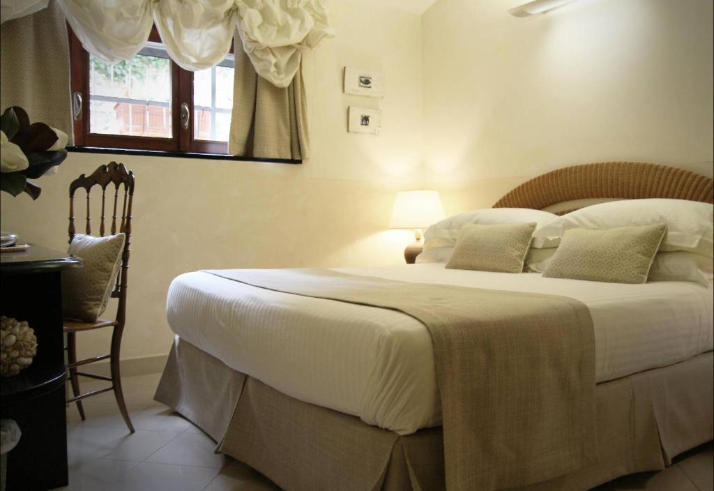Cama ou camas em um quarto em Locanda A Cà Du Gigante