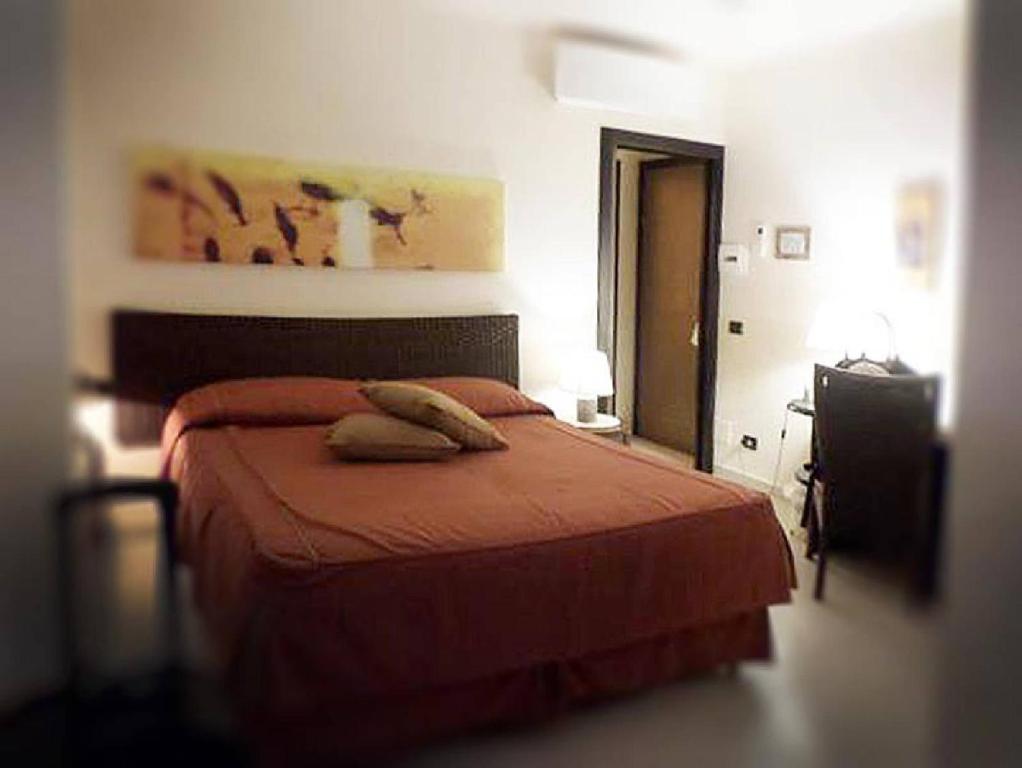 Cama ou camas em um quarto em Locanda A Cà Du Gigante