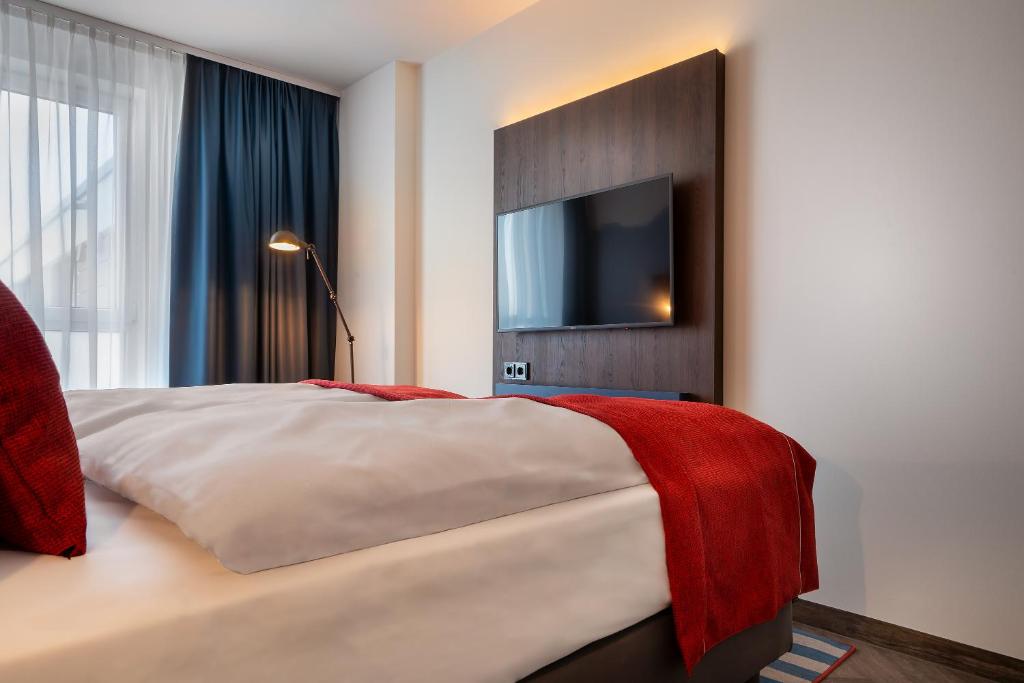 Postel nebo postele na pokoji v ubytování Holiday Inn - the niu, Keg Hamburg Ost by IHG