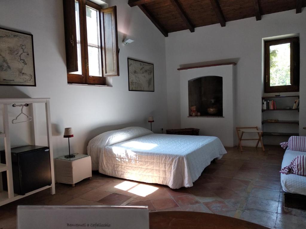 Posteľ alebo postele v izbe v ubytovaní Cefalicchio B&B