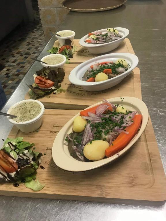 a group of plates of food on a table at Hotel du Rempart in Sancerre