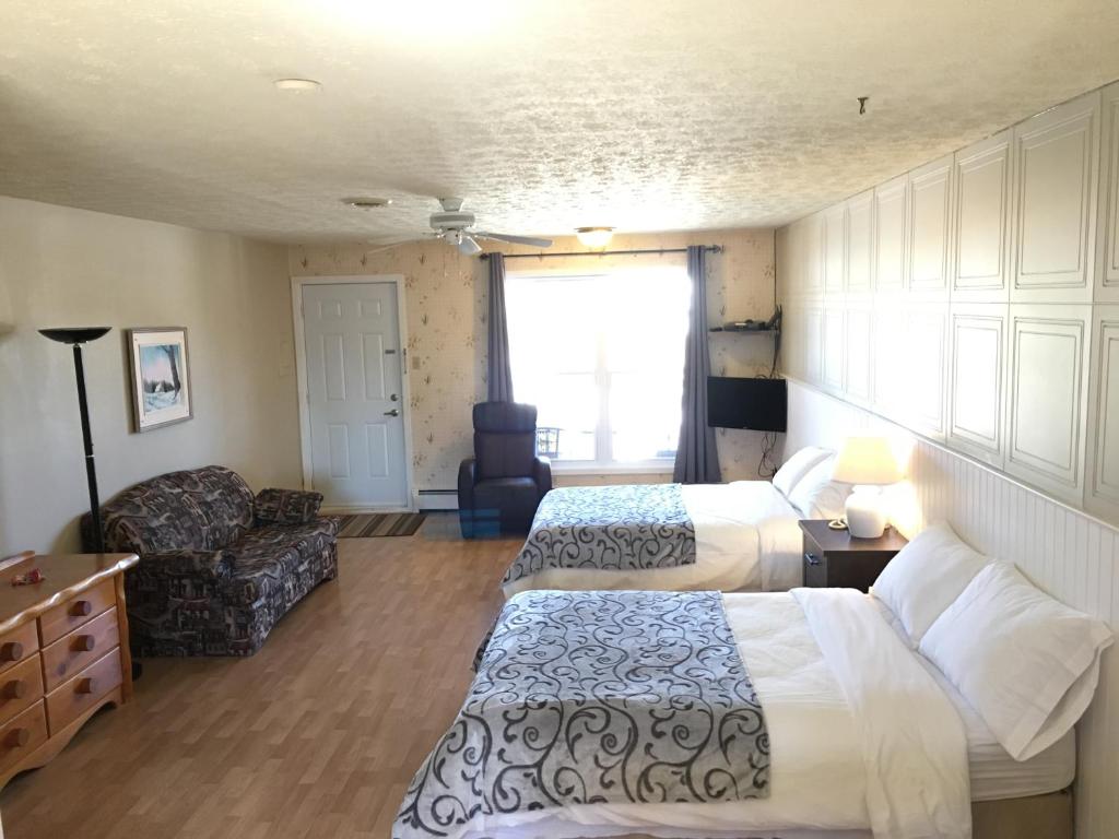 Postel nebo postele na pokoji v ubytování Motel le Sabre