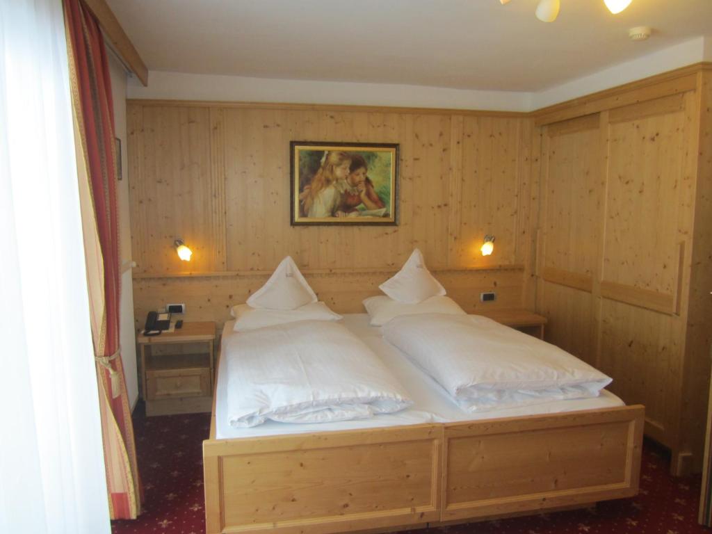 Postel nebo postele na pokoji v ubytování Hotel Ronce