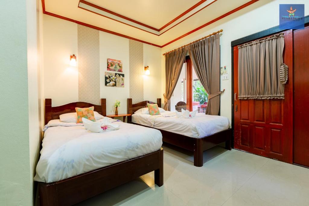 Postel nebo postele na pokoji v ubytování Starlight Haadrin Resort