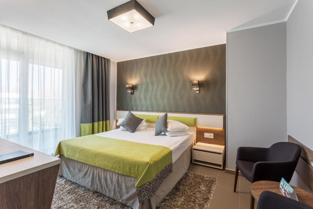 Postel nebo postele na pokoji v ubytování Splendid Conference & Spa Hotel – Adults Only