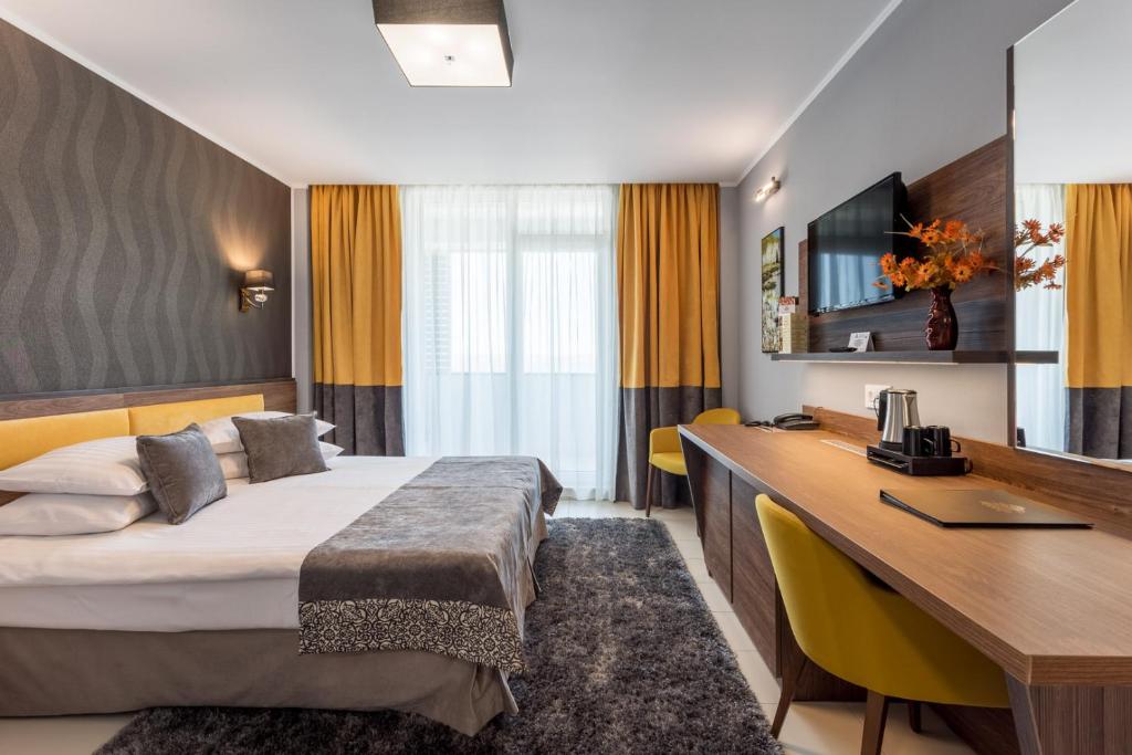 Postel nebo postele na pokoji v ubytování Splendid Conference & Spa Hotel – Adults Only