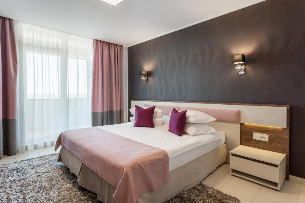 Postel nebo postele na pokoji v ubytování Splendid Conference & Spa Hotel – Adults Only