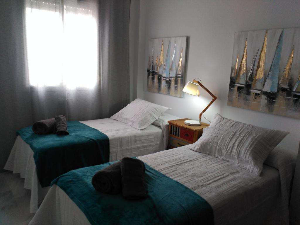 Posteľ alebo postele v izbe v ubytovaní Apartamento la albariza.