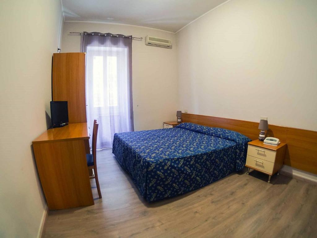 Postel nebo postele na pokoji v ubytování Albergo Dei Leoni