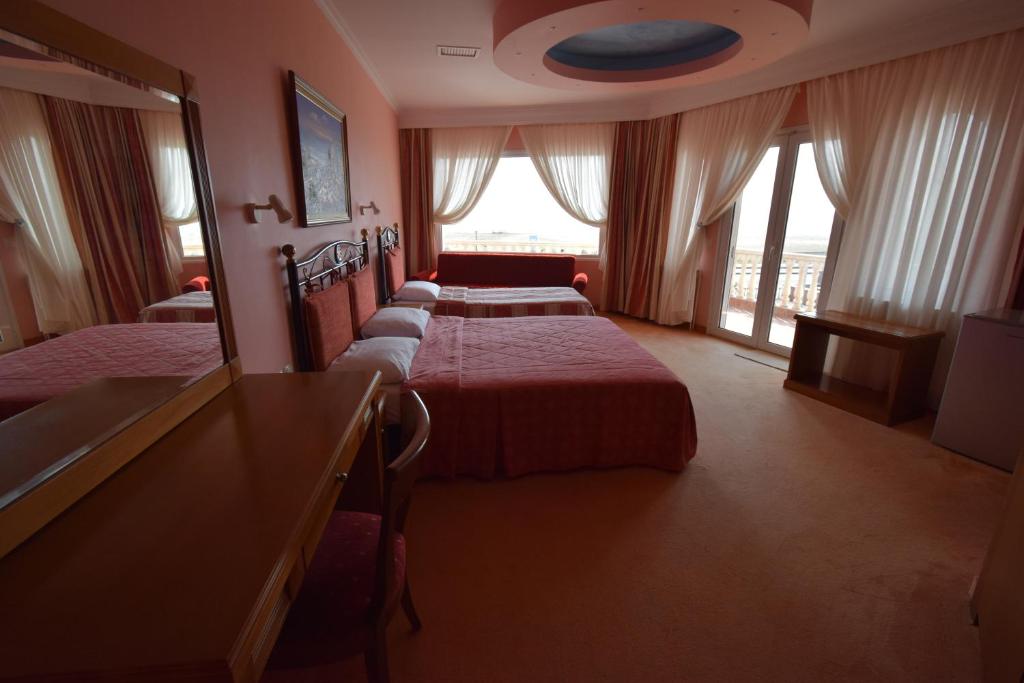 Postel nebo postele na pokoji v ubytování Hotel Aperio